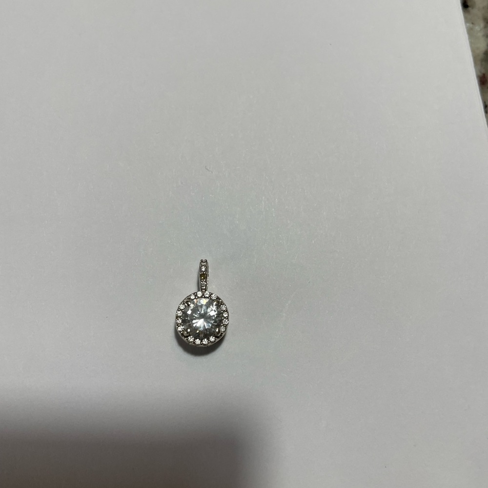 14 karat white gold diamond pendant with diamond accents, and 18 inch chain
